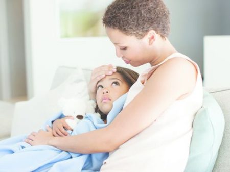 Woman hugging sick daughter